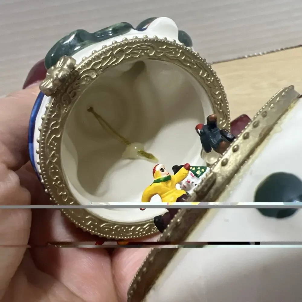Mr. Christmas Porcelain Snowman is a Hinged Music Box Ornament